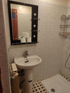 a bathroom with a sink and a mirror at Ryad dar midelt in Midelt +32 photos