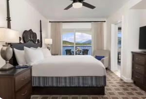 a bedroom with a bed and a view of the ocean at Saint Thomas Villa with Ocean view in Frenchmans Reef Heliport