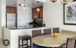 a kitchen with a table and chairs and a counter top at Saint Thomas Villa with Ocean view in Frenchmans Reef Heliport