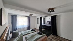 a bedroom with a bed and a large mirror at LandHaus Hof Wehlenbach in Hallenberg