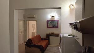 a living room with a couch and a tv at Perla di mare in La Maddalena