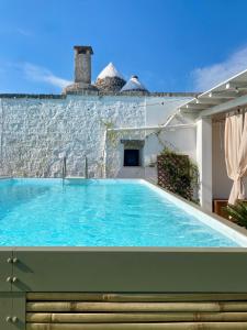 a swimming pool in the backyard of a villa at Villa Filou in Santa Lucia