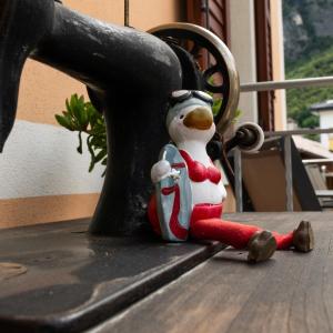a small figurine of a snowman sitting on a table at B&B Perbacco Relax in Mezzolombardo