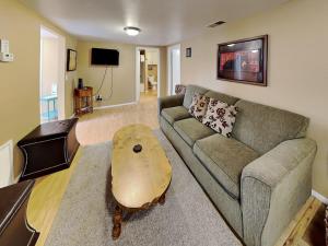 a living room with a couch and a coffee table at A Step Above in Ruidoso
