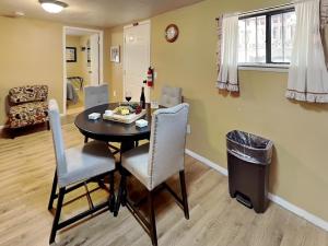 a dining room with a table and chairs at A Step Above in Ruidoso