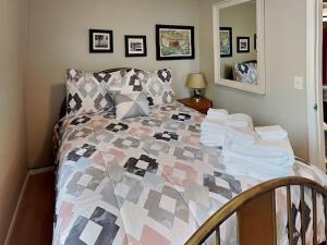 a bedroom with a bed with a quilt on it at A Step Above in Ruidoso +9 photos