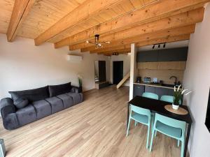 a living room with a couch and a table at Święty Spokój in Żeromin