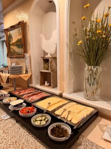 a buffet of different types of food on a table at Hotel Vierjahreszeiten in Breitengüßbach