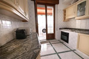 a kitchen with a sink and a counter top at Casa Rita in Gonnosfanàdiga