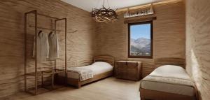 a bedroom with two beds and a window at Kilemche Boutique Hotel & Yurt Camp in Bagysh