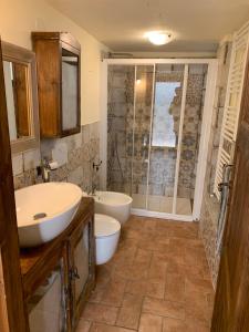 a bathroom with two sinks and a shower at Ancient townhouse next castle in Vezzano Ligure