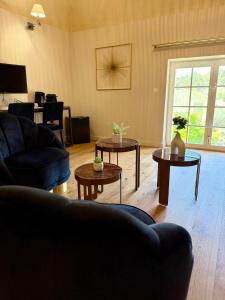 a living room with two tables and a couch at Domaine Robert in Rognes