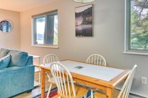a dining room with a table and chairs and a couch at Mountain Maryland Adventures Await in McHenry