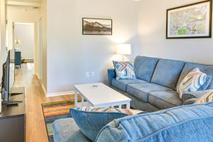 a living room with a couch and a table at Mountain Maryland Adventures Await in McHenry