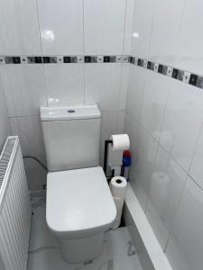 a bathroom with a white toilet in a room at The cumbria place in Elswick +8 photos