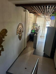 a room with a wall with a sculpture on it at Aparta hotel brisas Del tayrona in Santa Marta +29 photos