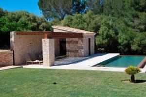 a house with a swimming pool in a yard at Luxury Villa Son Mas in Manacor