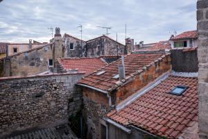 an aerial view of roofs in an old town at Mia Casa in Arles