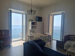 a living room with a view of the ocean at Casa Gargano Ravello Amalfi Coast in Amalfi