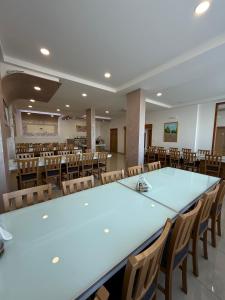a large conference room with a large table and chairs at Pansion Raspudić in Međugorje