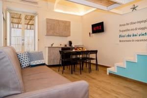 a living room with a couch and a table at Il borgo di Ulisse in Gaeta