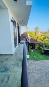 a house with a walkway leading to a patio at seaside residence negombo in Negombo