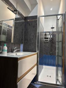 a bathroom with a sink and a shower at B&B Fiore di Maggio in Mola di Bari