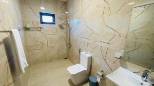 a bathroom with a toilet and a sink at seaside residence negombo in Negombo