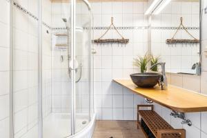 a bathroom with a shower and a sink at Ferienwohnung Wulf in Groß Zicker +24 photos