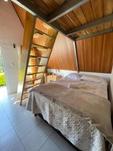 a bedroom with a bed and a wooden ceiling at #1 Jardín de las cabanas in San Pedro Carchá +5 photos