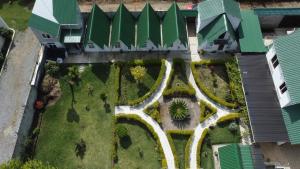 an aerial view of a garden with a road at #1 Jardín de las cabanas in San Pedro Carchá