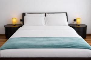 a bedroom with a bed with two night stands at B&B Casa Fortunata in Milan