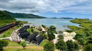 an aerial view of a river with boats in the water at Pandan View Mandeh Syariah in Pasarsungai-nyala