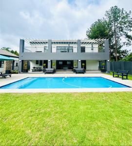 an exterior view of a house with a swimming pool at The Gentle Abode in Sandton