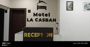 a room with a sign on the wall of a building at Motel La Casbah in Constantine