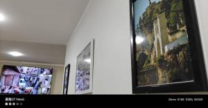 a room with two framed pictures on the wall at Motel La Casbah in Constantine +9 photos