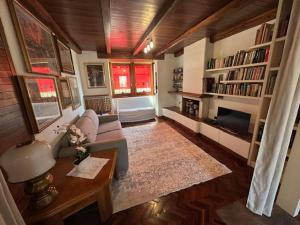 a living room with a couch and a fireplace at La Casa Gialla in Caorle
