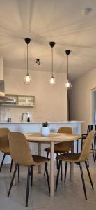 a dining room with a table and chairs at Apartment K2 in Pyrgi