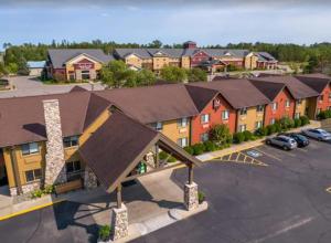 an aerial view of a building with a parking lot at I M Hotel by Timberlake in Grand Rapids