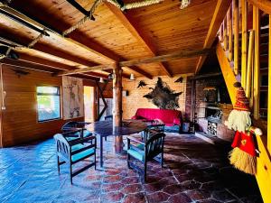 a dining room with a table and some chairs at Beautiful Rustic Cabin in Prejmer