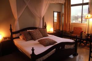 Postel nebo postele na pokoji v ubytování Q wine Hotel
