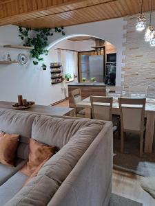 a living room with a couch and a table at Pension Renata in Šediviny +9 photos
