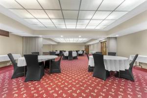 a conference room with tables and chairs on a red carpet at Best Western Braddock Inn in La Vale +45 photos