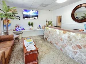 a waiting room with a couch and a counter at Blackfin Resort and Marina in Marathon