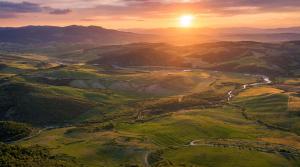 an aerial view of a valley at sunset at Bubble Glam I Poggetti in Micciano