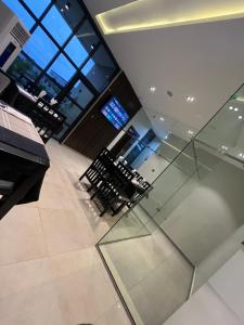 an empty room with chairs and a table in a building at Teestone Hotels and Apartment Ikeja in Lagos +88 photos