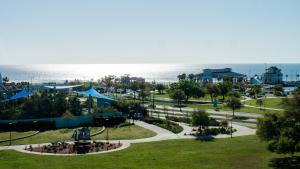 an amusement park with the ocean in the background at The Markham Hotel in Gulfport