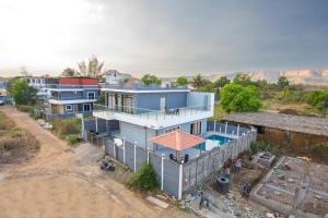 an aerial view of a house with a swimming pool at Jalsa Bungalow in Malavli