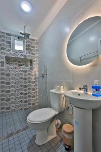 a bathroom with a toilet and a sink at A&C Blue Haven in Chefchaouen +35 photos