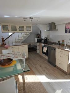 a kitchen with a table with a bowl on it at La Casa del Río in Porto do Son